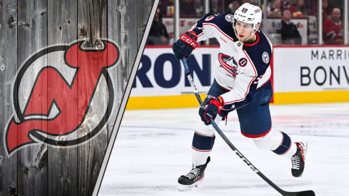 Yegor Chinakhov skates with the puck for the Columbus Blue Jackets amidst NHL trade rumors linking him to the New Jersey Devils.