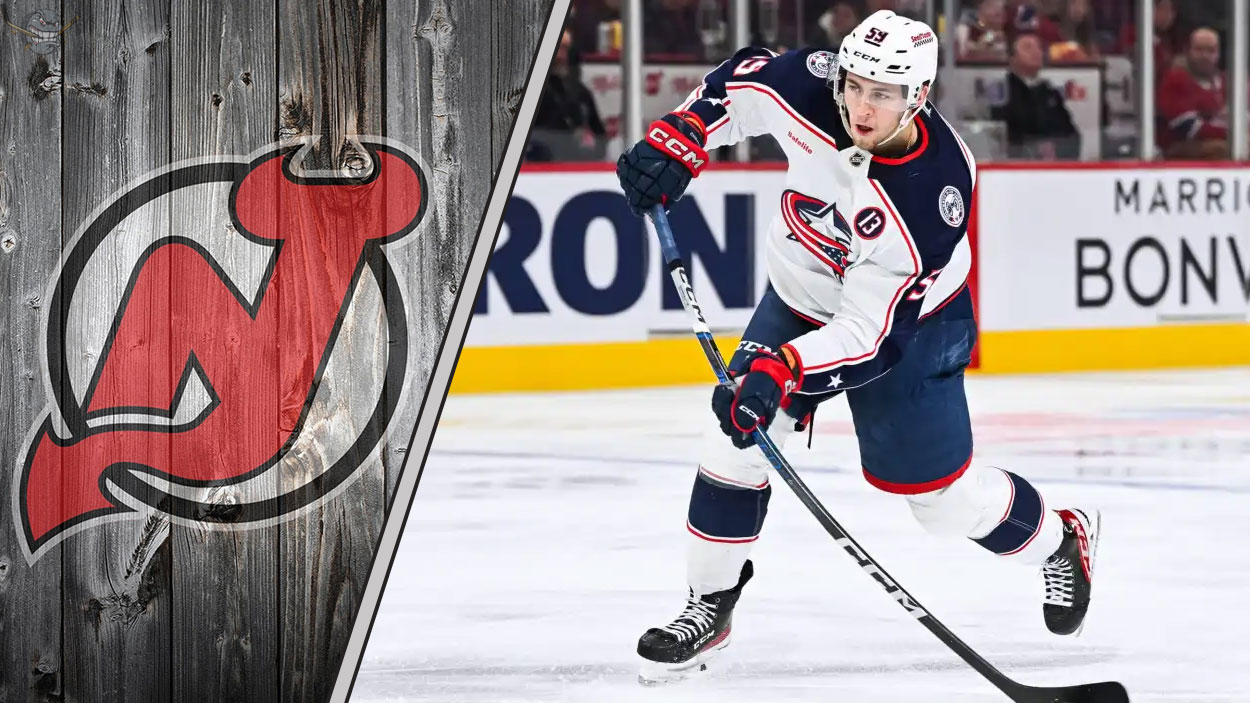 Yegor Chinakhov skates with the puck for the Columbus Blue Jackets amidst NHL trade rumors linking him to the New Jersey Devils.