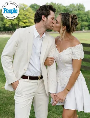 Brianna Chwala/The Unfiltered Collective  Benjamin Gleason kisses Madison Field, who wears her mom's altered wedding dress at her rehearsal dinner