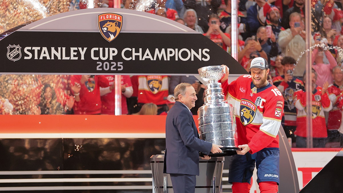 Gary Bettman and Sasha Barkov