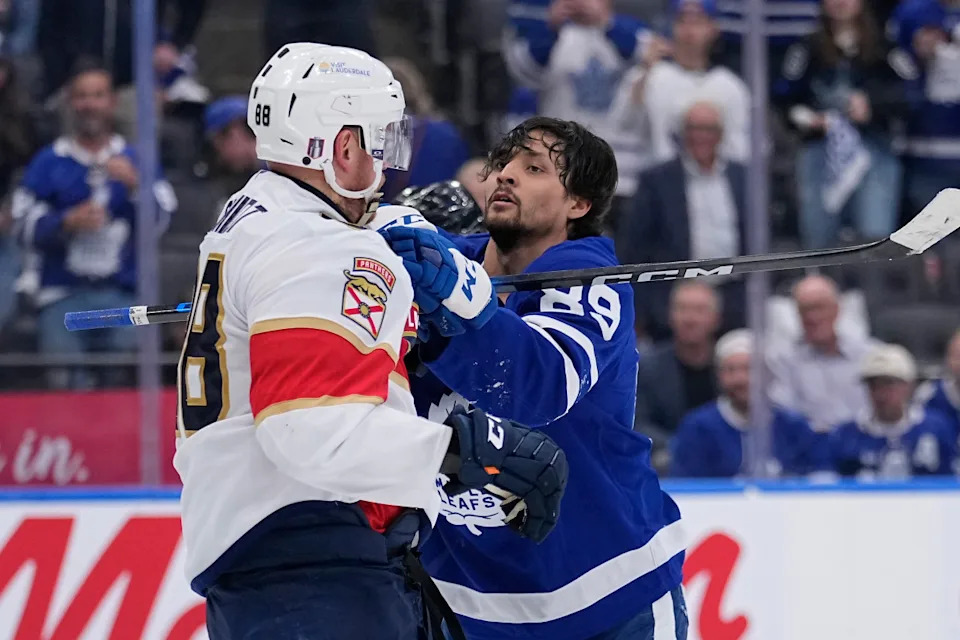 Toronto Maple Leafs forward Nicholas Robertson (89) and Florida Panthers defenseman Nate Schmidt during a scrum.John E&period; Sokolowski-Imagn Images