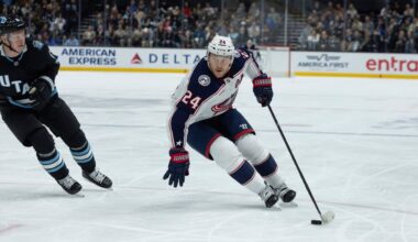Columbus Blue Jackets right wing Mathieu Olivier (24) skates with the puck against Utah Hockey Club defenseman Olli Maatta (2) during the second period of an NHL hockey game Friday, Jan. 31, 2025, in Salt Lake City.