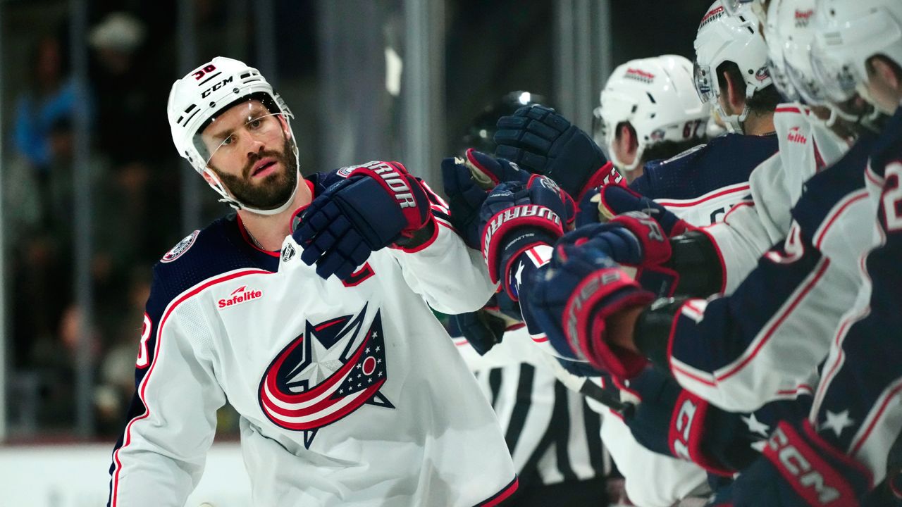 Columbus Blue Jackets center Boone Jenner celebrates his goal scored against the Arizona Coyotes during the first period of an NHL hockey game Tuesday, March 26, 2024, in Tempe, Ariz. (AP Photo/Ross D. Franklin)