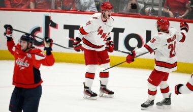 Carolina Hurricanes right wing Andrei Svechnikov (37) celebrates his goal with defenseman Sean Walker (26) in the third period of Game 5 of a second-round NHL hockey playoff series against the Washington Capitals Thursday, May 15, 2025, in Washington. (AP Photo/Nick Wass)