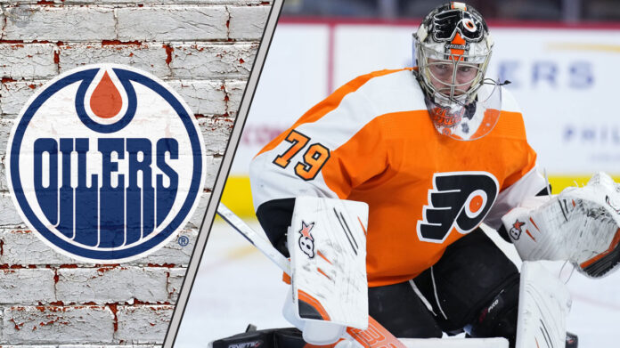 Goalie Carter Hart in his Philadelphia Flyers uniform, looking focused during a game, amidst swirling Edmonton Oilers trade rumors.