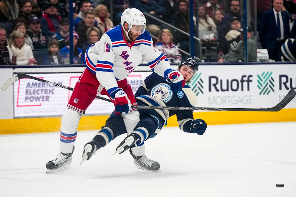 New York Rangers defenseman K'Andre Miller (79) hits Columbus Blue Jackets center Adam Fantilli (19) in the second period at Nationwide Arena on Saturday, Feb. 8, 2025 in Columbus, Ohio.
