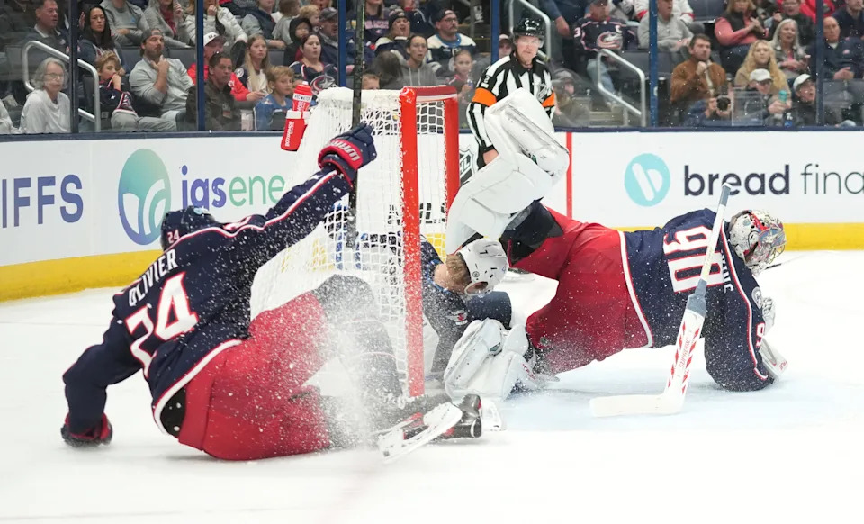 Winnipeg Jets center Vladislav Namestnikov (7) ends up in the net against Columbus Blue Jackets goaltender Elvis Merzlikins (90) during the second period at Nationwide Arena on November 1, 2024 in Columbus, Ohio. At left is Columbus Blue Jackets right wing Mathieu Olivier (24).