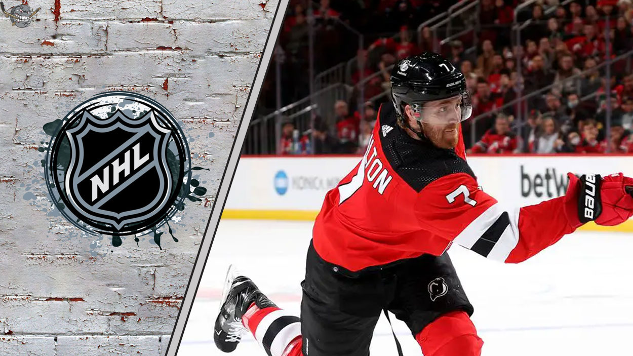 New Jersey Devils defenseman Dougie Hamilton skates with the puck during an NHL game, with "Dougie Hamilton Rumors" text overlay.