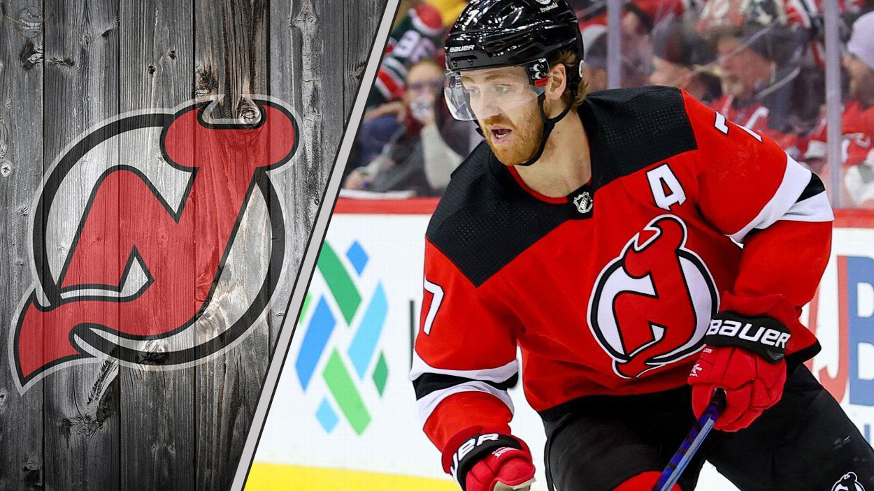 New Jersey Devils defenseman Dougie Hamilton looks on during an NHL game amid swirling NHL trade rumors.