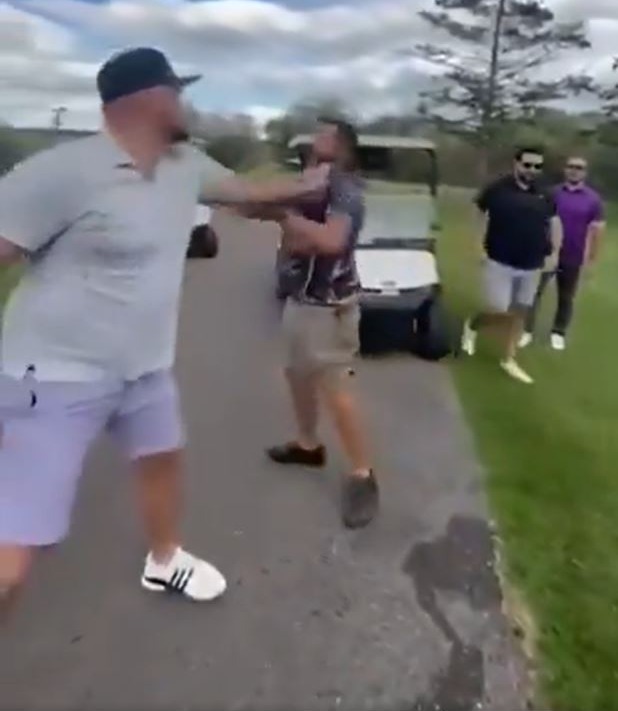 Fight breaking out at a golf course.