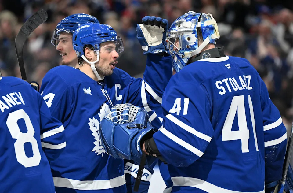 Toronto Maple Leafs goalie Anthony Stolarz (41) is greeted by forward Auston Matthews (34) after a win.Dan Hamilton-Imagn Images