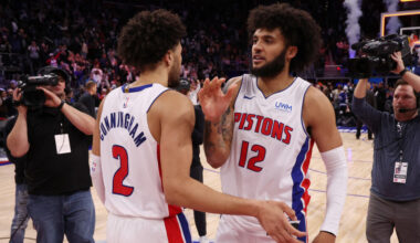 Isaiah Livers #12 and Cade Cunningham #2 of the Detroit Pistons react to a 129-127 win over the Tor...