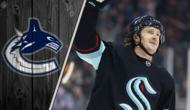 Jared McCann skates in his Seattle Kraken uniform, with the Vancouver Canucks logo faded into the background, illustrating recent NHL trade rumors.