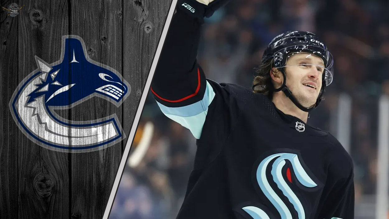 Jared McCann skates in his Seattle Kraken uniform, with the Vancouver Canucks logo faded into the background, illustrating recent NHL trade rumors.