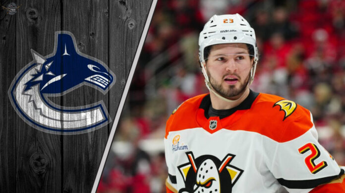 Anaheim Ducks forward Mason McTavish looks on during an NHL game, amidst recent NHL trade rumors linking him to the Vancouver Canucks.