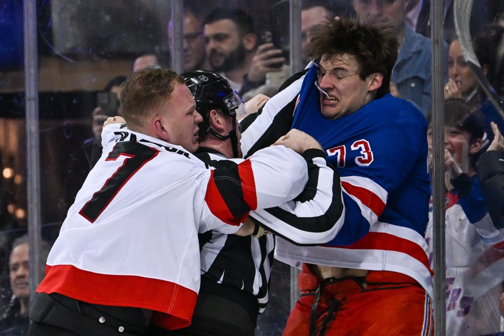 Rangers center Matt Rempe (73) and Ottawa Senators left wing Brady Tkachuk (7) fight during the third period at Madison Square Garden. 