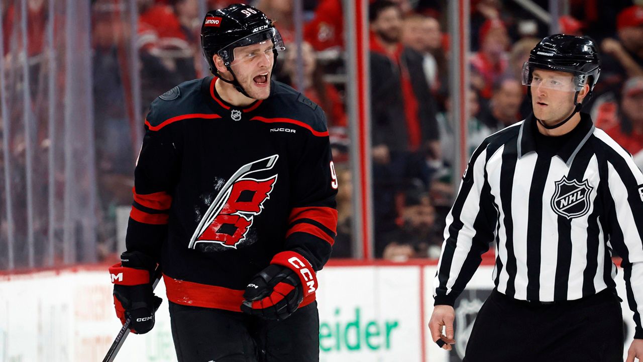Mikko Rantanen (96) protests against a penalty with an official during the third period of an NHL hockey game against the Edmonton Oilers in Raleigh, N.C., Saturday, March 1, 2025. (AP Photo/Karl DeBlaker)