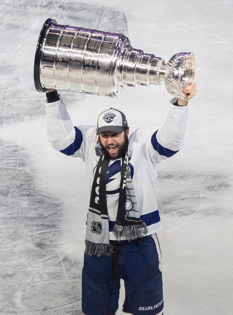 Tyler Johnson of the Tampa Bay Lightning raises the Stanley Cup.