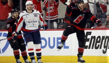 Carolina Hurricanes' Taylor Hall (71) celebrates after his goal with Washington Capitals' Matt Roy (3) nearby during the third period of Game 4 of second-round playoff series in Raleigh, N.C., Monday, May 12, 2025. (AP Photo/Karl DeBlaker)