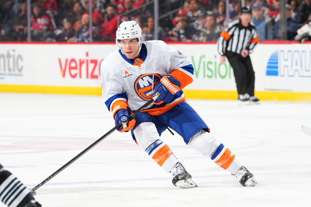 Tony DeAngelo #4 of the New York Islanders skating during a hockey game.