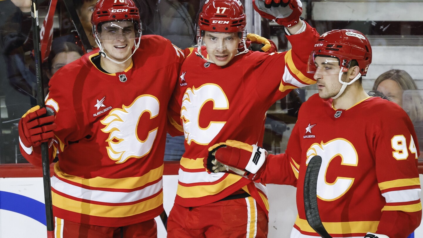 Flames beat the Sharks 5-2 to bolster their late playoff push