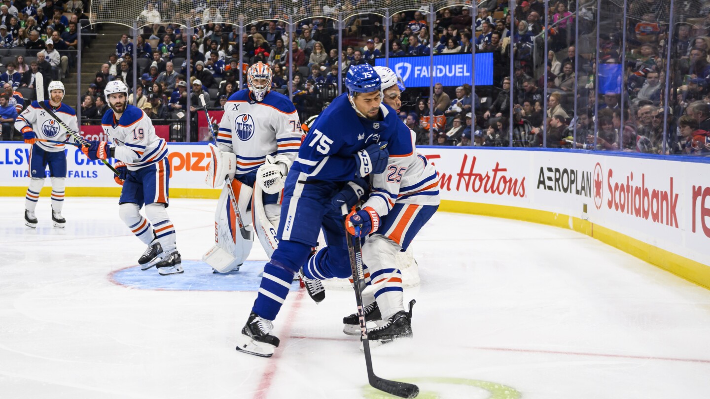 Oilers' Darnell Nurse left bloodied after hit to head from Maple Leafs' Reaves