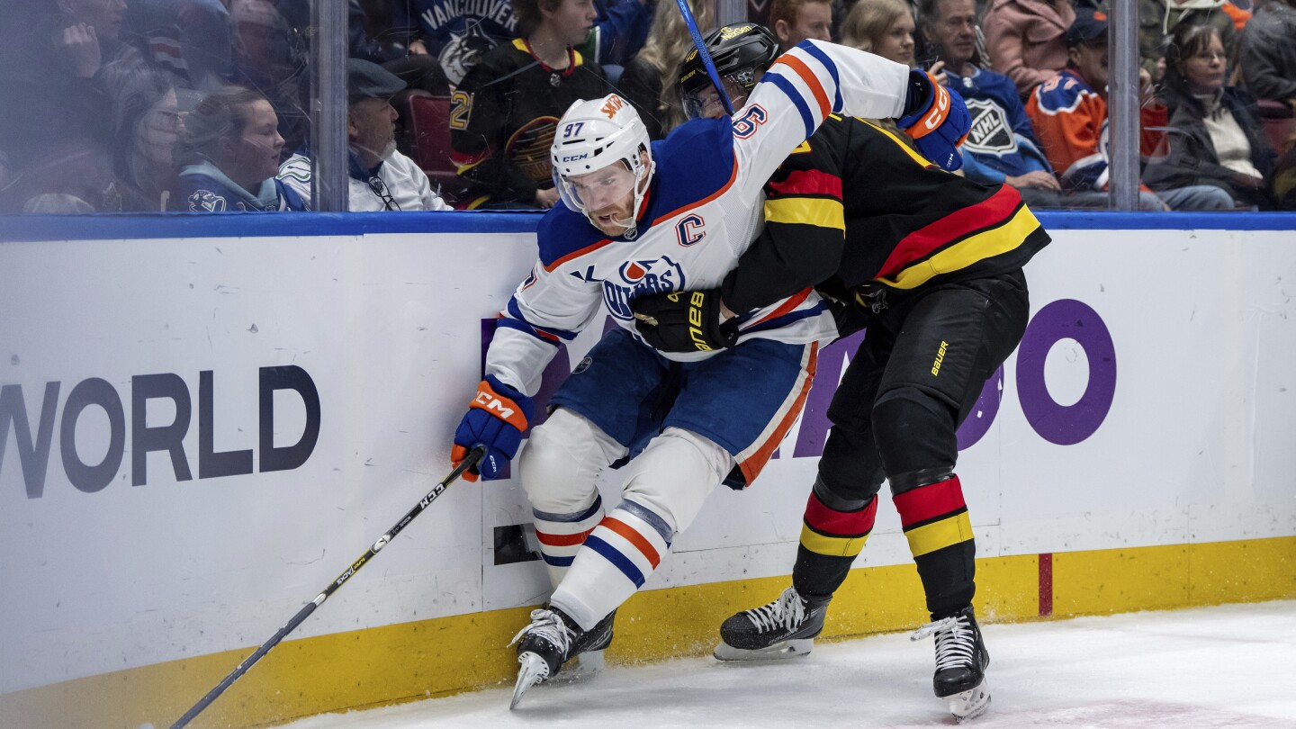Oilers captain Connor McDavid suspended 3 games for cross-checking Conor Garland in the head