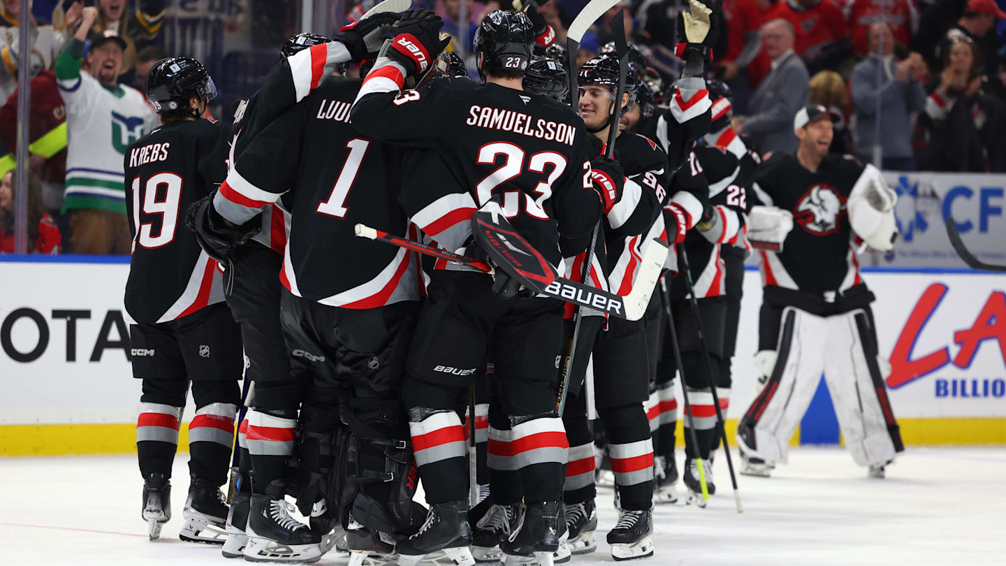Jan 6, 2025; Buffalo, New York, USA;  The Buffalo Sabres celebrate a shootout win over the Washington Capitals at KeyBank Center. Mandatory Credit: Timothy T. Ludwig-Imagn Images