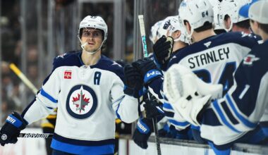 Jan 30, 2025; Boston, Massachusetts, USA; Winnipeg Jets center Mark Scheifele (55) celebrates with teammates after scoring a goal during the first period against the Boston Bruins at TD Garden. Mandatory Credit: Bob DeChiara-Imagn Images
