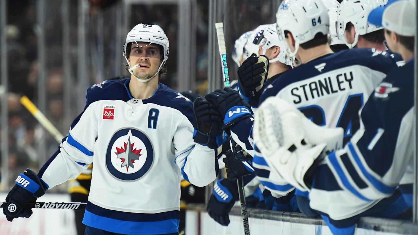 Jan 30, 2025; Boston, Massachusetts, USA; Winnipeg Jets center Mark Scheifele (55) celebrates with teammates after scoring a goal during the first period against the Boston Bruins at TD Garden. Mandatory Credit: Bob DeChiara-Imagn Images