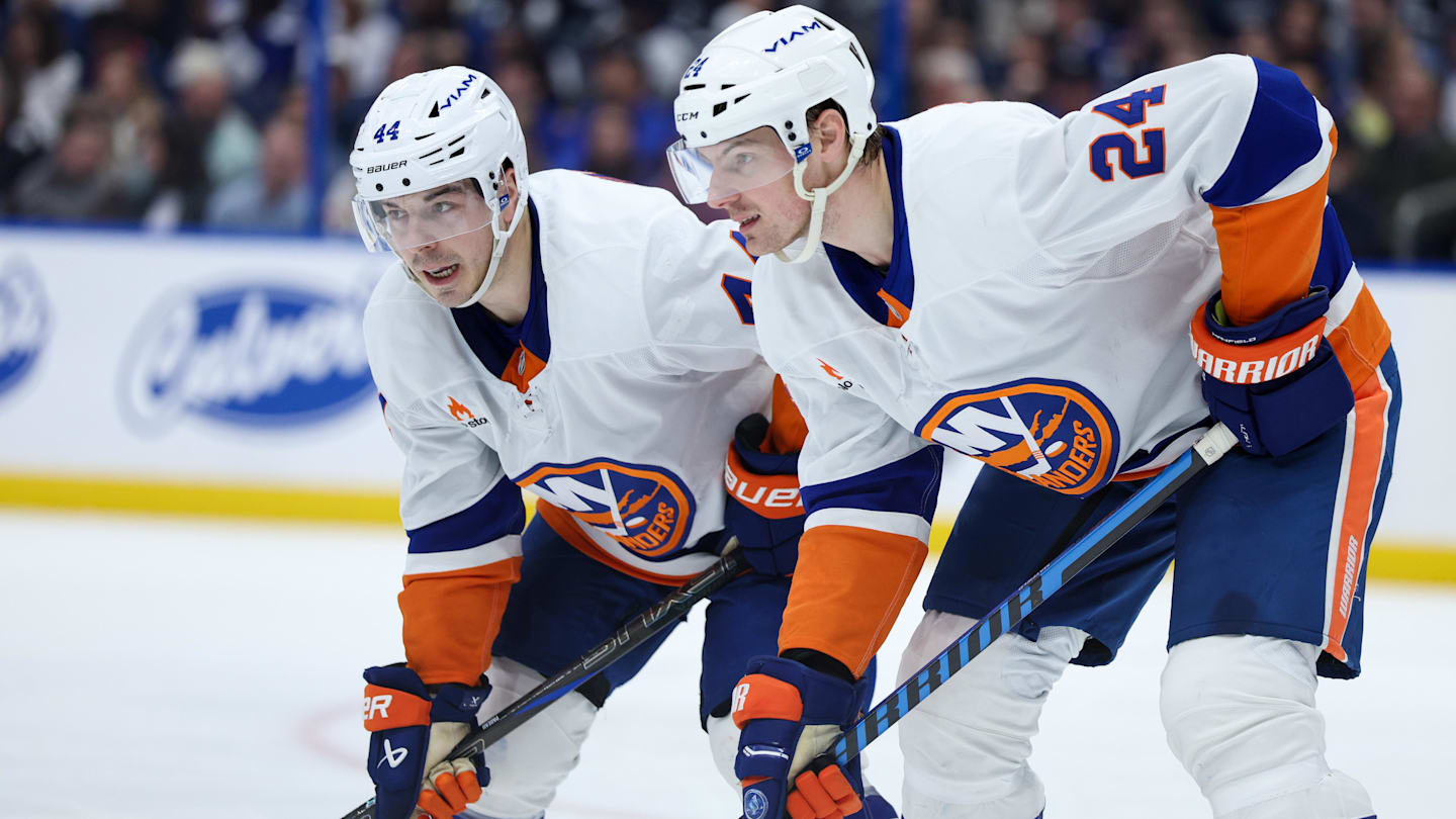 Feb 1, 2025; Tampa, Florida, USA; New York Islanders center Jean-Gabriel Pageau (44) talks to New York Islanders defenseman Scott Mayfield (24) against the Tampa Bay Lightning in the second period at Amalie Arena. Mandatory Credit: Nathan Ray Seebeck-Imagn Images
