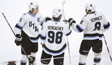 Mar 7, 2025; Chicago, Illinois, USA;   Utah Hockey Club center Clayton Keller (9) celebrates with defenseman Mikhail Sergachev (98) and Utah Hockey Club center Nick Schmaltz (8) after he scored a goal against the Chicago Blackhawks during the third period  at the United Center. Mandatory Credit: Matt Marton-Imagn Images