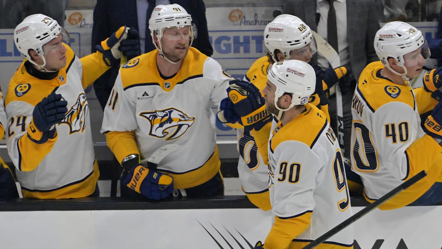 Jan 25, 2025; Anaheim, California, USA; Nashville Predators center Ryan O'Reilly (90) is congratulated at the bench after scoring a goal in the second period against the Anaheim Ducks at Honda Center. Mandatory Credit: Jayne Kamin-Oncea-Imagn Images