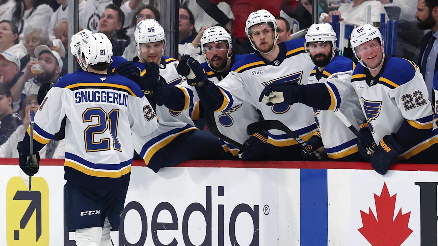 Apr 21, 2025; Winnipeg, Manitoba, CAN; St. Louis Blues right wing Jimmy Snuggerud (21) celebrates his goal against the Winnipeg Jets in the first period in game two of the first round of the 2025 Stanley Cup Playoffs at Canada Life Centre. Mandatory Credit: James Carey Lauder-Imagn Images