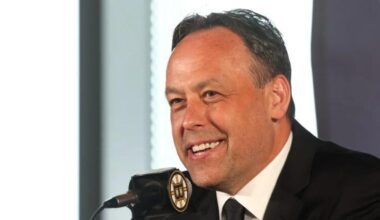 Bruins head coach Marco Sturm meets Mike Vrabel at Patriots practice