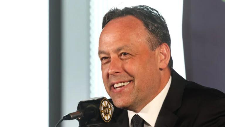 Bruins head coach Marco Sturm meets Mike Vrabel at Patriots practice