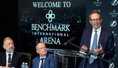 Tampa Bay Lightning co-owner Doug Ostrover, right, speaks as Benchmark International chariman and co-founder Steven Keane, left, and Vinik Sports Group CEO Steve Griggs, center, look on after Vinik Sports Group and Benchmark International announce a multi-year naming rights partnership for the arena during a news conference Wednesday, Aug. 13, 2025, in Tampa, Fla. (AP Photo/Chris O'Meara)