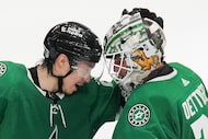 Dallas Stars left wing Jason Robertson (21) celebrates with goaltender Jake Oettinger after...