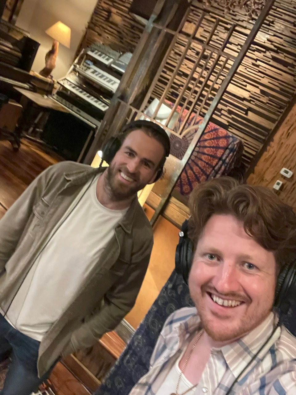 Nashville Predators forward Ryan O'Reilly, left, and Irish bluegrass band singer Jamie McKeogh pose in the Southern Ground Studio in Nashville in June 2025, where the hockey player contributed backing vocals on one of the band's songs