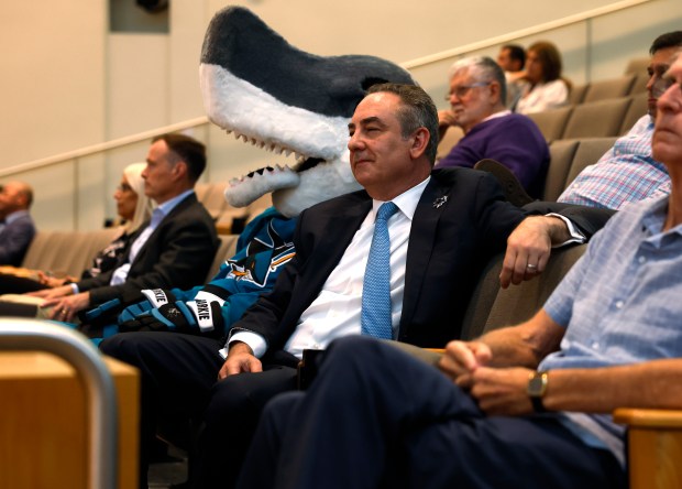 San Jose Sharks President Jonathan Becher sits with Sharks mascot...