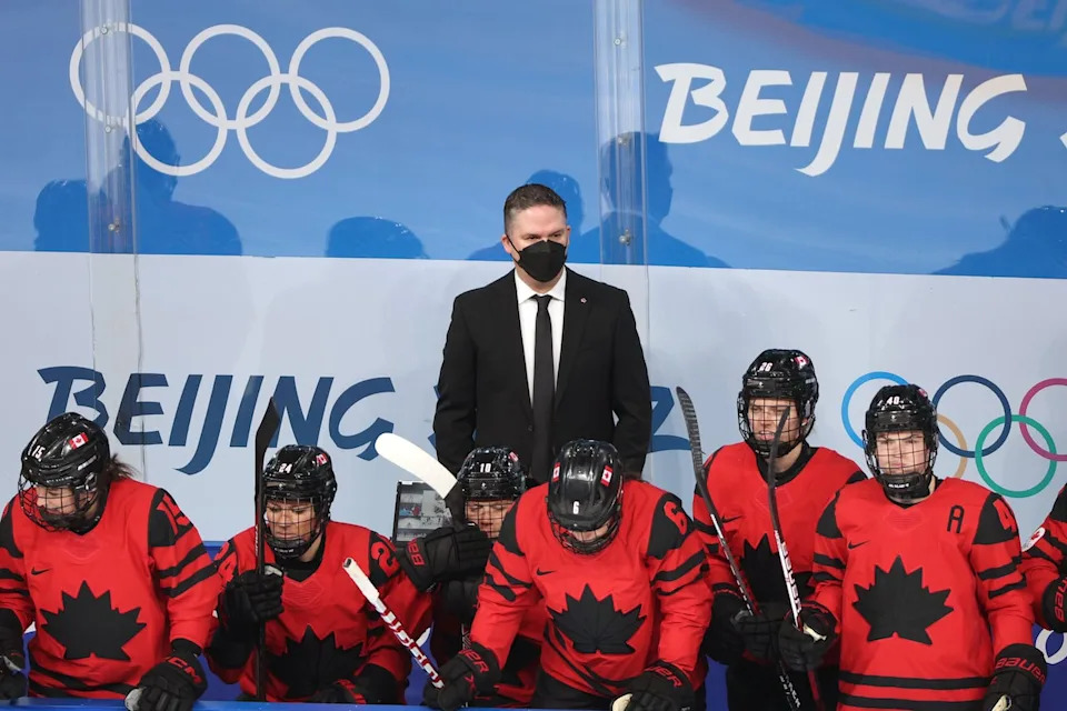 Head coach Troy Ryan of Team Canada looks on from behind the bench during the Women's Ice Hockey Gold Medal match between Team Canada and Team United States on Day 13 of the Beijing 2022 Winter Olympic Games at Wukesong Sports Centre on February 17, 2022 in Beijing, China. 