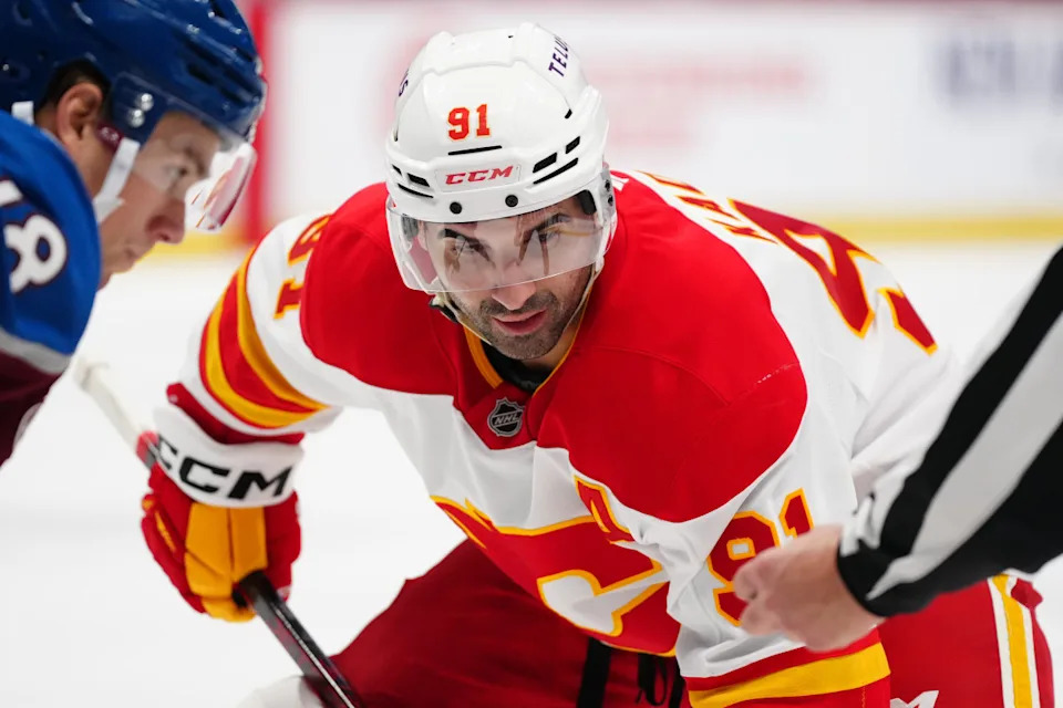 Calgary Flames center Nazem Kadri (91) prepares to take a face-off.Ron Chenoy-Imagn Images