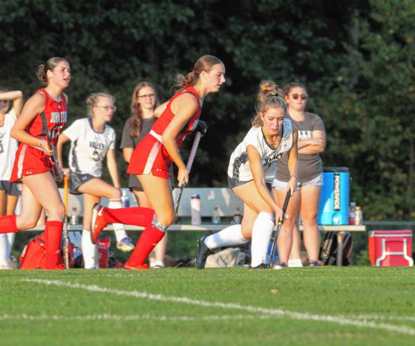 LEFT: Merrimack Valley forward Izzy Tucker dribbles past John Stark’s midfielders.