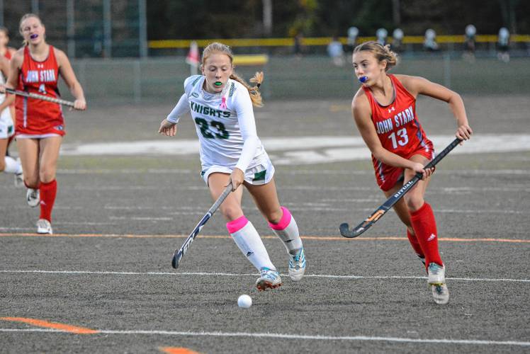 John Stark’s Caylin Worthen (13) moves the ball upfield during field hockey game at Kingswood on Wednesday, Oct. 2, 2024. Worthen scored a goal in the 3-0 victory.