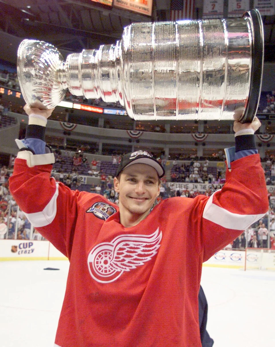 Detroit Red Wings Sergei Fedorov holds up the Stanley Cup after his team defeated the Washington Capitals in four straight games to win the NHL championship. Fedorov is from Russia. 