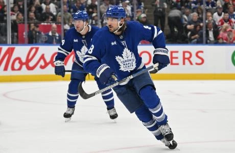 Toronto Maple Leafs defensemen Morgan Rielly and Chris Tanev in action during the pre-season. Toronto Maple Leafs defensemen Morgan Rielly and Chris Tanev in action during the pre-season.