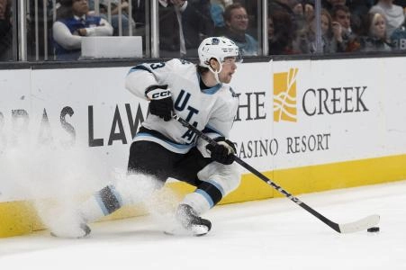 Dec 14, 2024; San Jose, California, USA; Utah Hockey Club left wing Matias Maccelli (63) controls the puck during the third period against the San Jose Sharks at SAP Center at San Jose. Mandatory Credit: Stan Szeto-Imagn Images