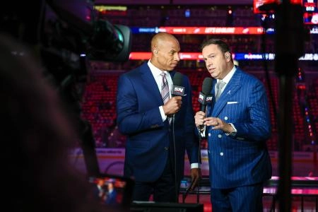 Jun 14, 2025; Edmonton, Alberta, CAN; Sportsnet host David Amber (left) and NHL Insider Elliotte Friedman (right) prior to the game between the Edmonton Oilers and the Florida Panthers in game five of the 2025 Stanley Cup Final at Rogers Place. Mandatory Credit: Sergei Belski-Imagn Images