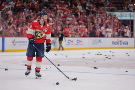 Jun 9, 2025; Sunrise, Florida, USA; Florida Panthers forward Matthew Tkachuk (19) puts a rat on the stick after the third period against the Edmonton Oilers in game three of the 2025 Stanley Cup Final at Amerant Bank Arena. Mandatory Credit: Sam Navarro-Imagn Images