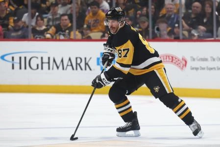 Apr 13, 2025; Pittsburgh, Pennsylvania, USA; Pittsburgh Penguins center Sidney Crosby (87) handles the puck against the Boston Bruins during the third period at PPG Paints Arena. Mandatory Credit: Charles LeClaire-Imagn Images